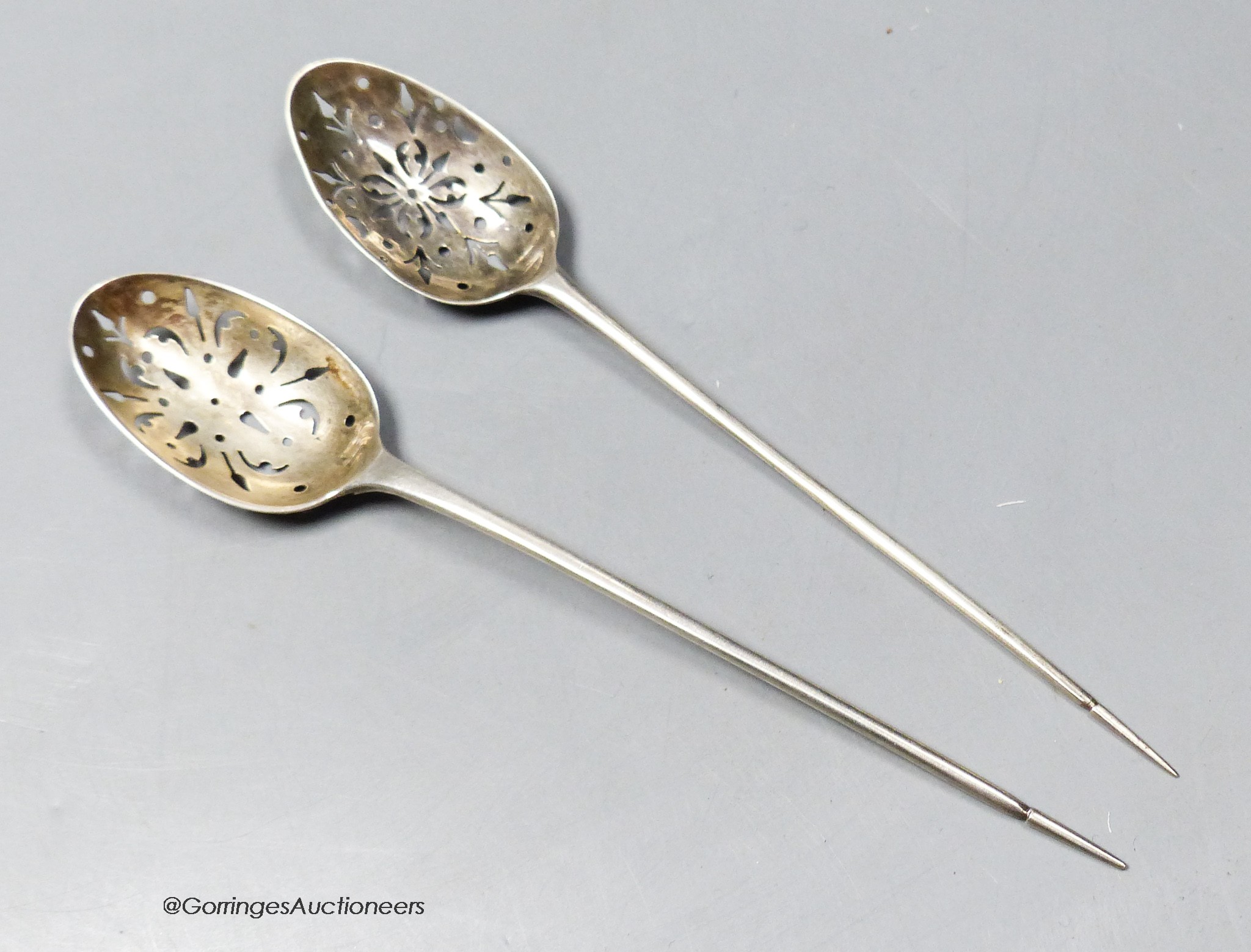 Two Georgian silver mote spoons, one with maker's mark I.T, longest 14.4cm.